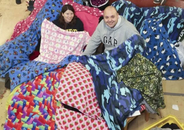 Firm donates blankets to help homeless
