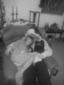 Brotherly love...JJ and his sister snuggle up in their onesies